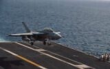 An F/A-18 Super Hornet attached to Strike Fighter Squadron (VFA) 195 lands aboard Nimitz-class aircraft carrier USS George Washington (CVN 73), October 1, 2026, in the Middle East. (U.S. Navy photo)