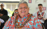 Samoan Prime Minister La’aulialemalietoa Leuatea Schmidt watches a rugby match between Auckland’s Tipene College and Samoa’s Wesley College with his New Zealand counterpart Christopher Luxon in the village of Faleula, Samoa, on March 17, 2026. (Ben STRANG/AFP)