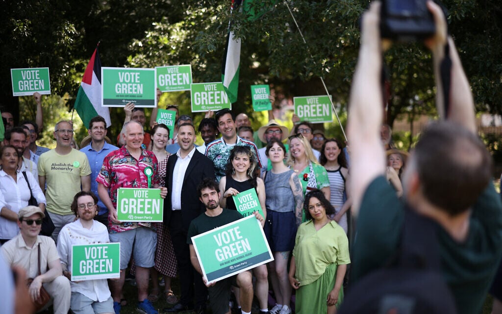 Britain’s leader of the Green Party, Zack Polanski poses with supporters after speaking at a rally in a park in south London, on June 24, 2026. (Henry Nicholls/ AFP)