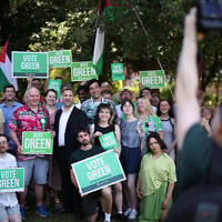 Britain’s leader of the Green Party, Zack Polanski poses with supporters after speaking at a rally in a park in south London, on June 24, 2026. (Henry Nicholls/ AFP)