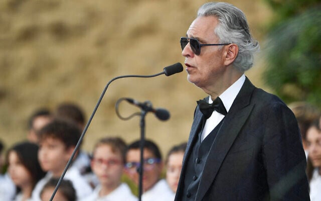Italian tenor Andrea Bocelli performs in front of Pope Leo XIV during a concert in Borgo Laudato Si, a 55-hectare educational and environmental center, at Castel Gandolfo on July 29, 2026. (Isabella BONOTTO/AFP) Italian tenor Andrea Bocelli performs in front of Pope Leo XIV during a concert in Borgo Laudato Si, a 55-hectare educational and environmental center, at Castel Gandolfo on July 29, 2026. (Isabella BONOTTO/AFP)