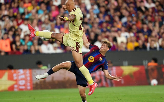 Barcelona’s Israeli midfielder #32 Orian Goren (R) vies for the ball with Al Ahly’s Egyptian defender #26 Amr El Gazar during the 61st Joan Gamper Trophy football match between FC Barcelona and Al Ahly FC at the Camp Nou Stadium in Barcelona on August 19, 2026. (Lluis GENE/AFP) Barcelona’s Israeli midfielder #32 Orian Goren (R) vies for the ball with Al Ahly’s Egyptian defender #26 Amr El Gazar during the 61st Joan Gamper Trophy football match between FC Barcelona and Al Ahly FC at the Camp Nou Stadium in Barcelona on August 19, 2026. (Lluis GENE/AFP)