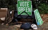 Campaigners for Britain’s leader of the Green Party, Zack Polanski, prepare signs before his arrival in London on September 12, 2026. (Toby Shepheard/ AFP)