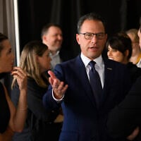 Pennsylvania Gov. Josh Shapiro speaks to AI executives backstage before delivering a keynote speech during the AI Horizons Summit at Bakery Square on September 17, 2026 in Pittsburgh, Pennsylvania. (Jeff Swensen/Getty Images/AFP)