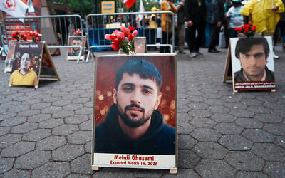 PIctures of protesters who were killed by the Iranian state security forces during the nationwide anti-government demonstrations that took place in Iran in January, are seen during a Free Iran Rally outside of the United Nations General Assembly on September 22, 2026 in New York City. (Ryan Murphy/Getty Images/AFP)