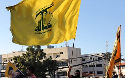 Supporters of Hezbollah wave flags of the terror group during a ceremony held to mark the second anniversary of the killing of leader Hassan Nasrallah in a strike by Israel, in Beirut’s southern suburbs, Lebanon, September 27, 2026. (Anwar AMRO/AFP)