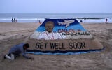 A sculpture made by India’s sand artist Sudarsan Pattnaik depicts India’s pilot Smit Machchhar, the captain of flydubai flight FZ 1073, at a beach in Odisha’s Puri city on October 1, 2026. (AFP)