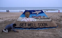 A sculpture made by India’s sand artist Sudarsan Pattnaik depicts India’s pilot Smit Machchhar, the captain of flydubai flight FZ 1073, at a beach in Odisha’s Puri city on October 1, 2026. (AFP)