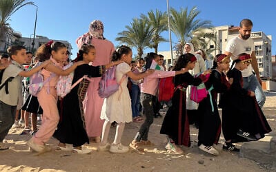 Displaced children from the Gaza Strip, stand in line as they attend a Palestinian school in the Egyptian city of El-Arish, near the border with the Gaza Strip, on October 1, 2026. (Amr AHMED/AFP)