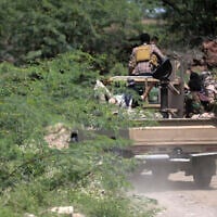 Saudi-backed Yemen government soldiers ride in a pick-up truck near the Jabal Han front, west of the city of Taiz, on October 3, 2026. (AHMAD AL-BASHA/AFP)