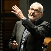 This handout photo taken on April 13, 2023, and released on October 6, 2026, shows Francis Halzen, UW–Madison Vilas Research Professor, speaking about the UW IceCube Neutrino Observatory Project at the University of Wisconsin-Madison. (Bryce RICHTER/University of Wisconsin/AFP)