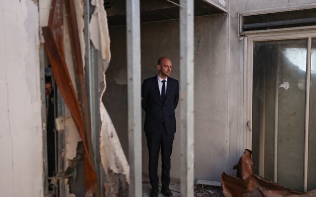 France’s Foreign Minister Jean-Noel Barrot visits a property that was damaged in the October 7 attack by Hamas in 2023, in Kibbutz Be'eri on October 7, 2026. (Ilia YEFIMOVICH/AFP)