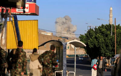 A plume of smoke rises during a reported airstrike by the Saudi-led coalition on the Houthi-controlled Yemeni capital Sanaa, on October 9, 2026. (AFP) A plume of smoke rises during a reported airstrike by the Saudi-led coalition on the Houthi-controlled Yemeni capital Sanaa, on October 9, 2026. (AFP)