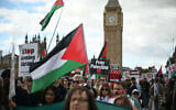 People cross Westminster Bridge as they take part in a march organized by Palestine Solidarity Campaign, in central London, on October 10, 2026. (JUSTIN TALLIS/AFP)