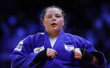Israel’s Raz Hershko reacts after winning the women’s over 78 kg bronze medal bout at the World Judo Championships in Baku, Azerbaijan, on October 10, 2026. (Anne-Christine Poujoulat/AFP)