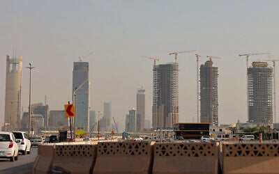 Vehicles drive past city skyscrapers in Riyadh on October 11, 2026. (Fayez Nureldine/AFP) Vehicles drive past city skyscrapers in Riyadh on October 11, 2026. (Fayez Nureldine/AFP)