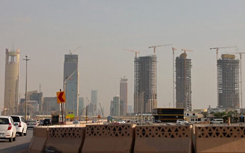 Vehicles drive past city skyscrapers in Riyadh on October 11, 2026. (Fayez Nureldine/AFP)