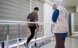Zuhdi Abou Shanab, a 17-year-old Palestinian boy who lost his entire right leg below the hip during the war in Gaza, undergoes rehabilitation treatment with his prosthetic at a medical centre in Amman on October 13, 2026 as part of the 'Jordanian medical corridor' initiative. (George SAIF/AFP)
