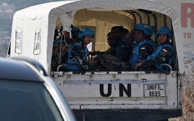 Members of the Indonesian contingent of the United Nations Interim Force in Lebanon (UNIFIL) ride in a vehicle in Lebanon’s southern border village of Ibl al-Saqi on October 13, 2026. (Joseph EID/AFP)