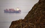 FILE: The Chinese-flagged container shipping vessel Hui Fa transits the Gulf of Oman off the coast of Khor Fakkan in the emirate of Sharjah in the east of the UAE on October 13, 2026. (AFP)
