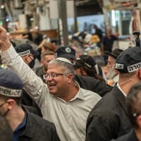 National Security Minister Itamar Ben Gvir, center, tours the market in Ramle on October 14, 2026. (Ilia YEFIMOVICH/AFP)