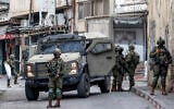 IDF soldiers deploy during a military operation at the Jalazun camp for Palestinian refugees north of Ramallah in the West Bank on October 14, 2026. (Zain JAAFAR/AFP)