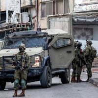 IDF soldiers deploy during a military operation at the Jalazun camp for Palestinian refugees north of Ramallah in the West Bank on October 14, 2026. (Zain JAAFAR/AFP)