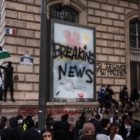 A protester waves a Palestinian flag as he gathers with others to demonstrate against the “high cost of living,” in Paris on October 17, 2026, amid nationwide unrest in France. (Kiran Ridley/AFP) A protester waves a Palestinian flag as he gathers with others to demonstrate against the “high cost of living,” in Paris on October 17, 2026, amid nationwide unrest in France. (Kiran Ridley/AFP)