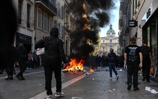 Rioters and looters seen in central Marseille, southern France, on October 17, 2026 as part of a nationwide protest movement. (Thibaud MORITZ/AFP)