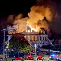 Fire burns and destroys the city hall after a group of individuals forced entry into the building during ongoing protest action against cost of living, in Limoges, central France, on October 17, 2026. (Melaine PAYZAL/AFP)
