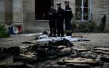 French gendarmes stand among rubbles and damages at the Hotel de Nesmond, the state’s official residence in Gironde, in Bordeaux, southwestern France, on October 18, 2026 a day after the building became a target of rioters during a nationwide protests against the “high cost of living." (Philippe Lopez/AFP)