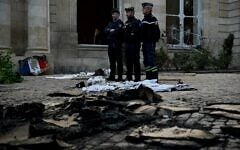 French gendarmes stand among rubbles and damages at the Hotel de Nesmond, the state’s official residence in Gironde, in Bordeaux, southwestern France, on October 18, 2026 a day after the building became a target of rioters during a nationwide protests against the “high cost of living." (Philippe Lopez/AFP)