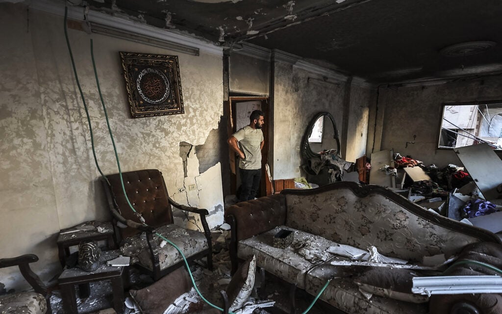 A man inspects the damage following an Israeli strike on a building that killed two people in Gaza City on October 20, 2026. (Omar AL-QATTAA/AFP) A man inspects the damage following an Israeli strike on a building that killed two people in Gaza City on October 20, 2026. (Omar AL-QATTAA/AFP)
