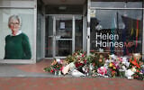 Floral tributes are placed outside the offices of Australian lawmaker Helen Haines who was critically wounded in a “targeted” attack, in Wangaratta on October 21, 2026. (Martin KEEP/AFP)