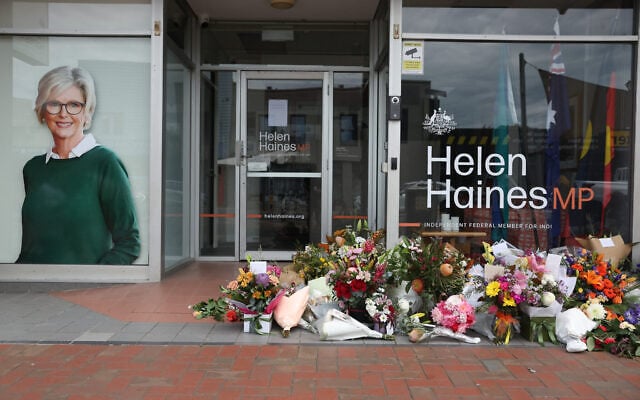 Floral tributes are placed outside the offices of Australian lawmaker Helen Haines who was critically wounded in a “targeted” attack, in Wangaratta on October 21, 2026. (Martin KEEP/AFP)