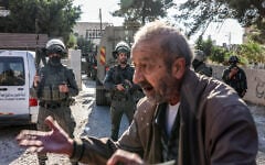 A Palestinian farmer reacts after Israeli forces blocked the road leading to an olive grove, having declared the olive-growing area a closed military zone, in the village of Deir Jarir in the West Bank on October 21, 2026. (Zain JAAFAR/AFP)