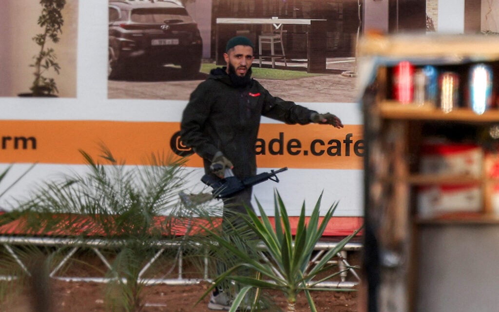 A Palestinian gunman during a gun battle with Israeli troops after a shooting attack at a checkpoint near Hebron in the West Bank on October 23, 2026. (HAZEM BADER/AFP)