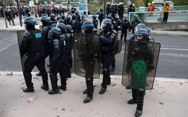 French Police officers in riot gear block access to the Peripherique ring road after protesters attempt to reach it during a demonstration in Paris on October 24, 2026. (Sameer AL-DOUMY/AFP)