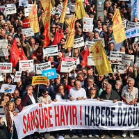 Protesters chant slogans and hold a banner reading 'No to Censorship, Freedom for News' during a rally against what they described as growing pressure on journalists including arrests and media shutdowns, in Ankara, Turkey, on October 24, 2026. (ADEM ALTAN/AFP)