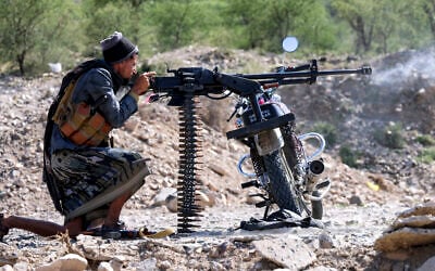 A fighter loyal to Yemen’s internationally-recognized government fires a machine gun balanced on a motorcycle at a position along the frontlines against the Houthis around Mount al-Midan in Yemen’s western Taiz province on October 26, 2026. (Ahmad AL-BASHA/AFP) A fighter loyal to Yemen’s internationally-recognized government fires a machine gun balanced on a motorcycle at a position along the frontlines against the Houthis around Mount al-Midan in Yemen’s western Taiz province on October 26, 2026. (Ahmad AL-BASHA/AFP)