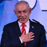 Prime Minister Benjamin Netanyahu addresses his supporters at an election night event after the exit polls were announced, in Jerusalem on early October 28, 2026. (Jewel Samad/AFP)