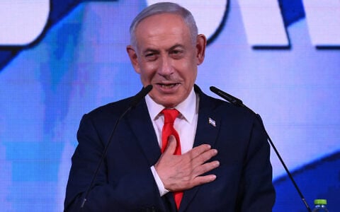 Prime Minister Benjamin Netanyahu addresses his supporters at an election night event after the exit polls were announced, in Jerusalem on early October 28, 2026. (Jewel Samad/AFP)