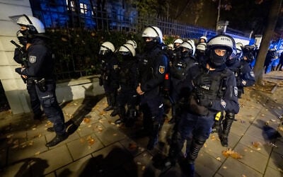 Police officers stand on alert as protesters gather outside the headquarters of Poland’s Constitutional Court in Warsaw after police blocked access to the building on October 30, 2026. (Wojtek RADWANSKI/AFP) Police officers stand on alert as protesters gather outside the headquarters of Poland’s Constitutional Court in Warsaw after police blocked access to the building on October 30, 2026. (Wojtek RADWANSKI/AFP)