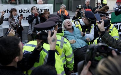 A pro-Palestinian, anti-Israel activist is carried away by police officers after being arrested during a protest in support of Palestine Action, which the UK government has proscribed as a terror group, outside the US Embassy in London on October 31, 2026. (Carlos Jasso/AFP) A pro-Palestinian, anti-Israel activist is carried away by police officers after being arrested during a protest in support of Palestine Action, which the UK government has proscribed as a terror group, outside the US Embassy in London on October 31, 2026. (Carlos Jasso/AFP)