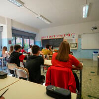 Illustrative: Teachers and students sit in a classroom at a highs school in Rome, September 13, 2021. (AP Photo/Andrew Medichini)
