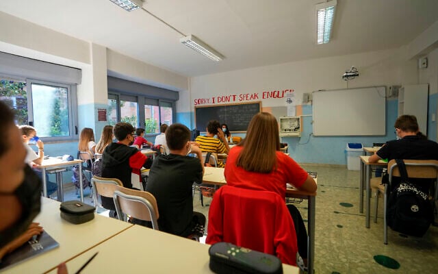 Illustrative: Teachers and students sit in a classroom at a highs school in Rome, September 13, 2021. (AP Photo/Andrew Medichini)