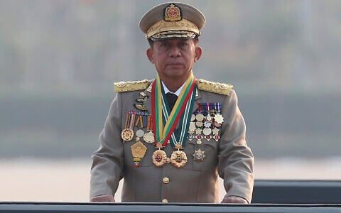 Senior general-turned-president Min Aung Hlaing inspects a parade marking Myanmar’s 78th Armed Forces Day in Naypyitaw, Myanmar, March 27, 2023. (AP Photo/Aung Shine Oo)