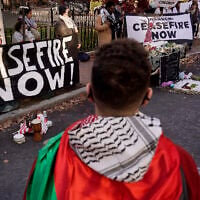 Illustrative: A protester from Somerville, Massachusetts front, joins with other pro-Palestinian, anti-Israel demonstrators as they display signs outside the home of US Senator Elizabeth Warren, during a protest November 19, 2023, in Cambridge, Massachusetts, held to call for a cease fire in the Israel-Hamas war in Gaza. (AP Photo/Steven Senne)
