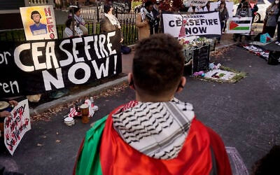 Illustrative: A protester from Somerville, Massachusetts front, joins with other pro-Palestinian, anti-Israel demonstrators as they display signs outside the home of US Senator Elizabeth Warren, during a protest November 19, 2023, in Cambridge, Massachusetts, held to call for a cease fire in the Israel-Hamas war in Gaza. (AP Photo/Steven Senne)