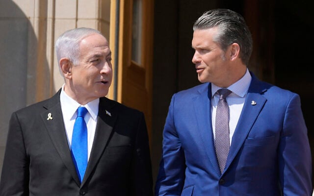 Prime Minister Benjamin Netanyahu (left) and US Secretary of Defense Pete Hegseth talk during an honor cordon ceremony at the Pentagon, July 9, 2025, in Washington. (AP Photo/Mark Schiefelbein)